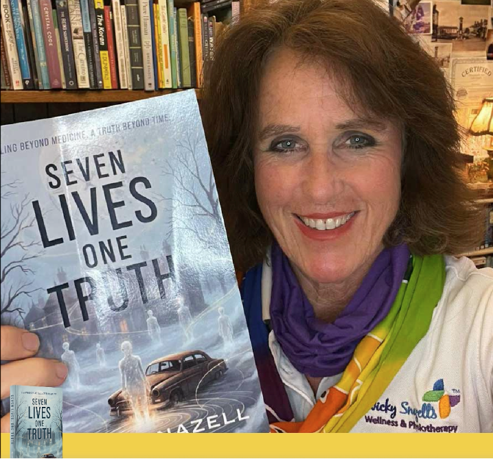 Nicky Snazell Smiling showing her new book